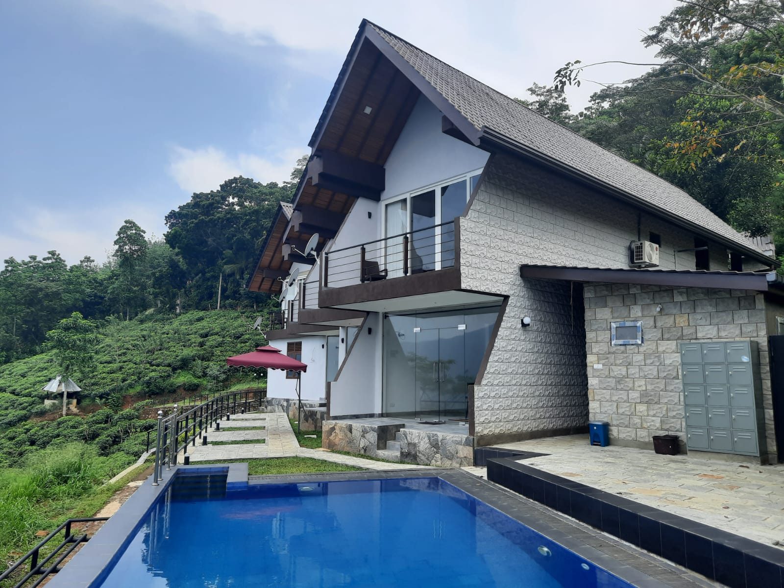 Terrace Cinnamon View villa exterior with swimming pool in daylight