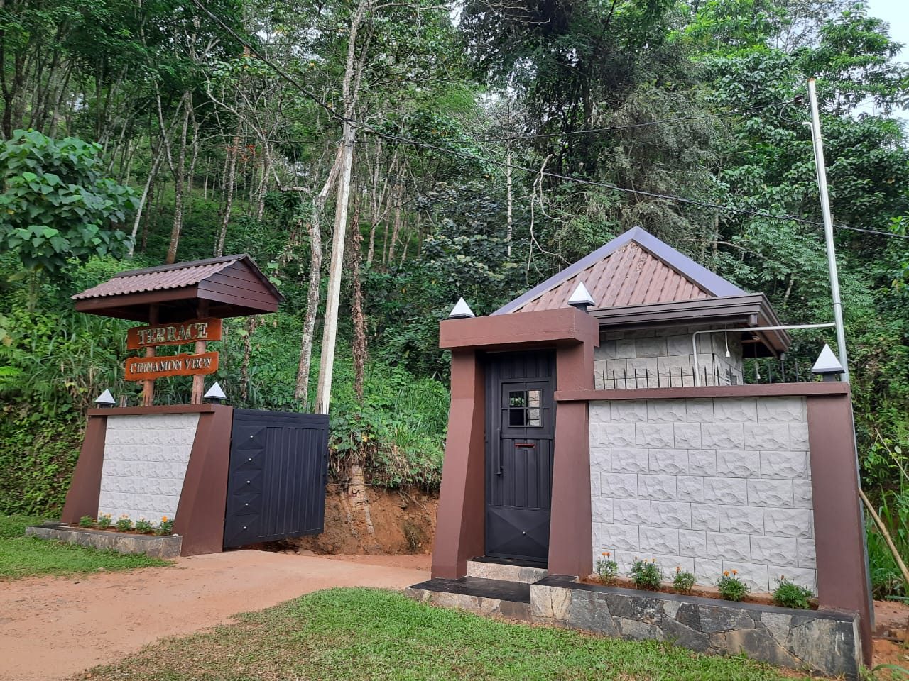 Terrace Cinnamon View hotel entrance gate and signboard