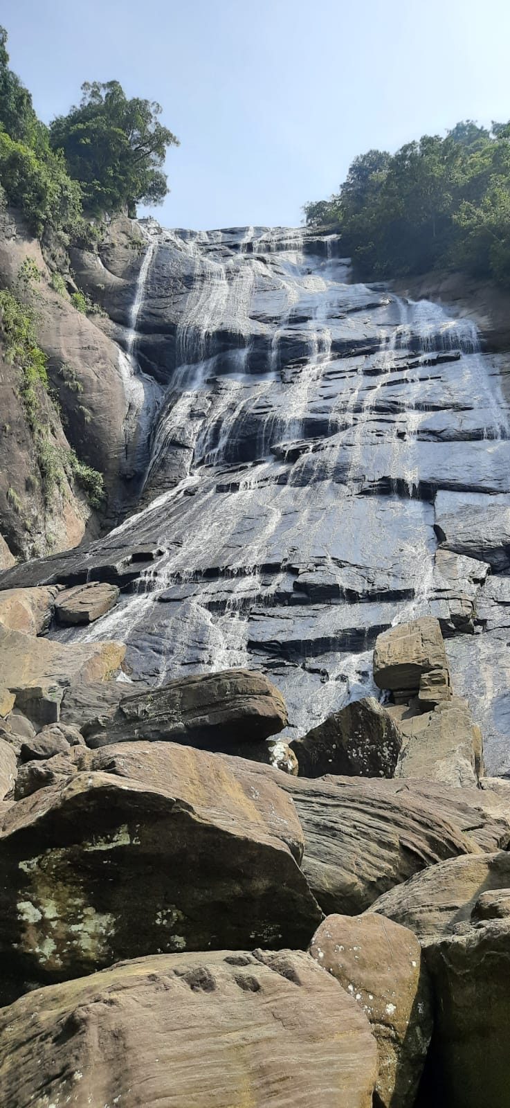 Tall waterfall cascade on a highland excursion from Terrace Cinnamon View