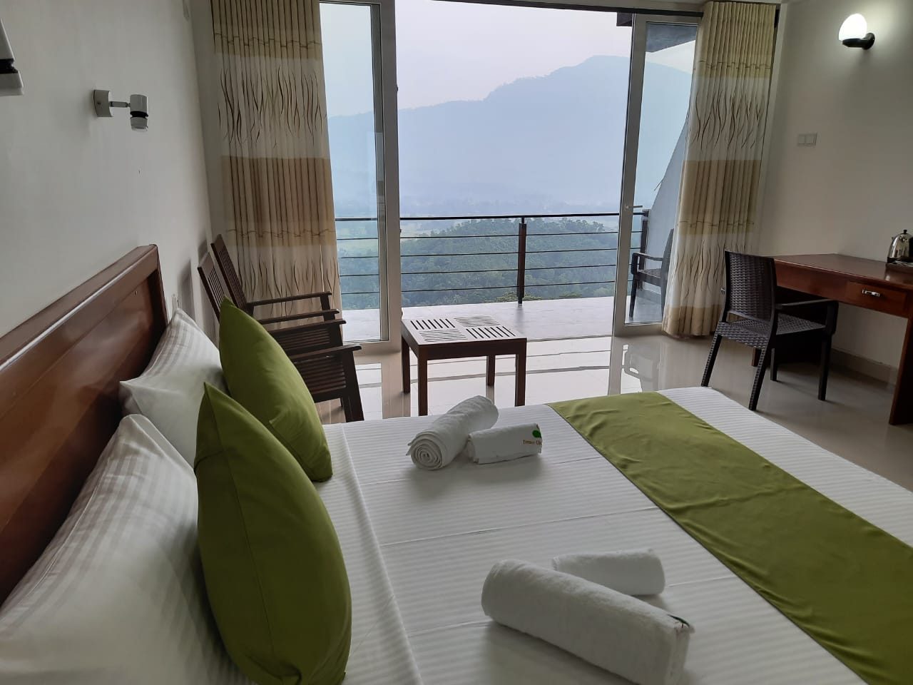 Terrace Cinnamon View double room interior at dusk with mountain view